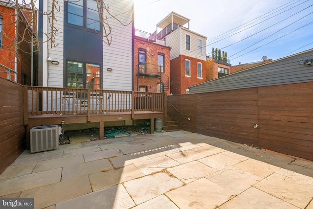 view of patio featuring fence and cooling unit