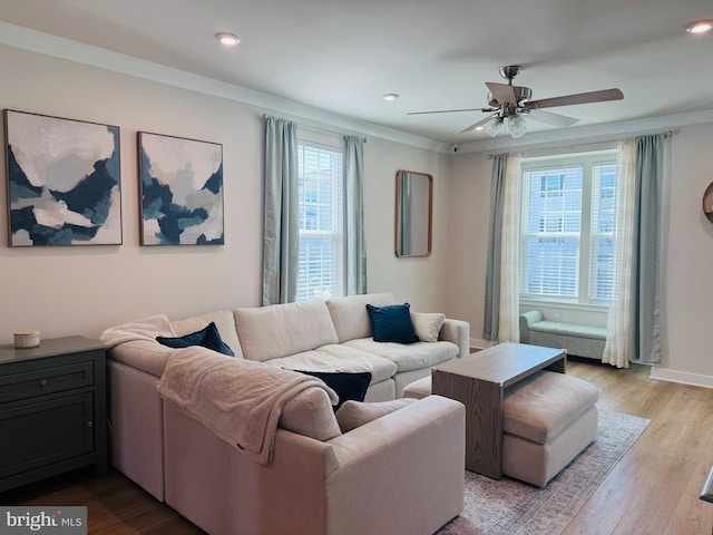 living area with ceiling fan, baseboards, wood finished floors, and recessed lighting