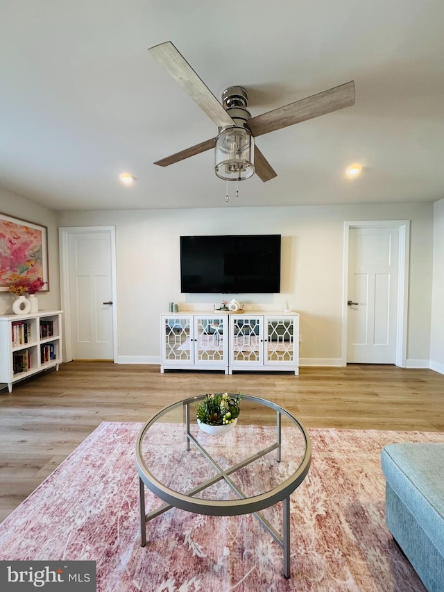 living room with ceiling fan, baseboards, wood finished floors, and recessed lighting