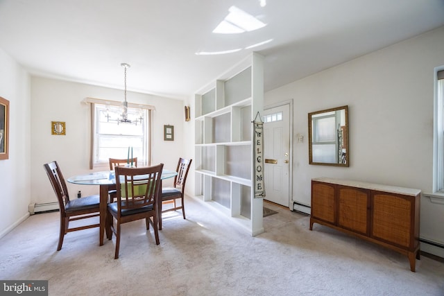 dining area featuring a baseboard radiator, light carpet, baseboard heating, and a chandelier