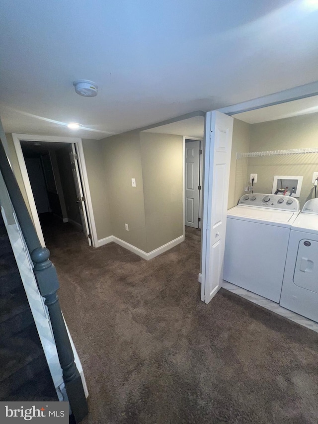 finished below grade area with carpet floors, baseboards, and separate washer and dryer