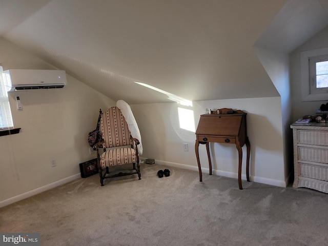 sitting room featuring carpet floors, baseboards, and a wall mounted AC