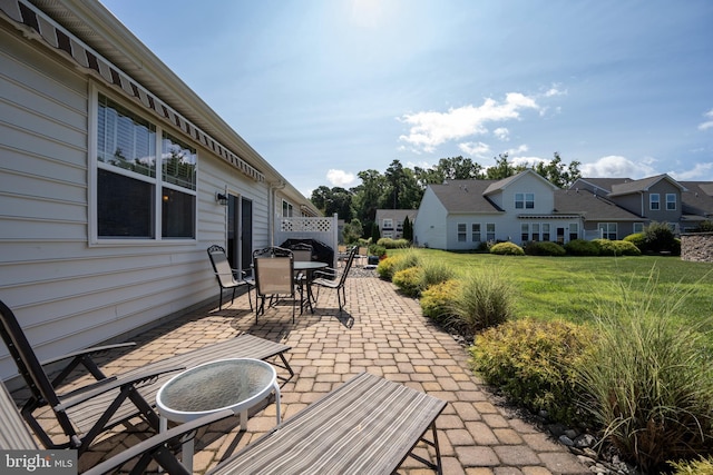 view of patio / terrace with a residential view and outdoor dining area