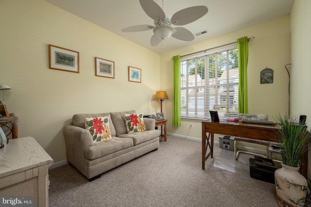 office area with ceiling fan, visible vents, baseboards, and carpet flooring