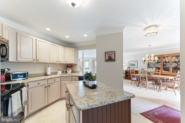 kitchen featuring light stone countertops, black appliances, ornamental molding, and a chandelier