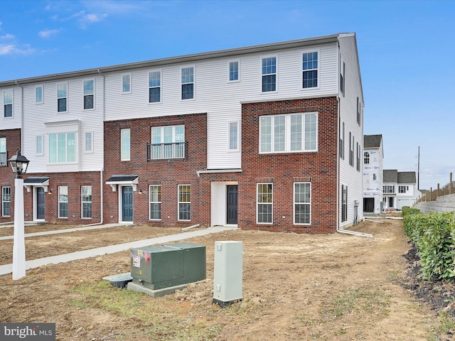 view of front of home featuring brick siding