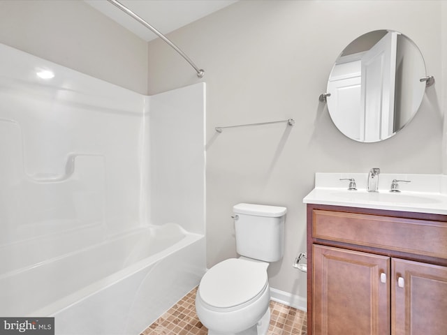 bathroom with washtub / shower combination, baseboards, vanity, and toilet