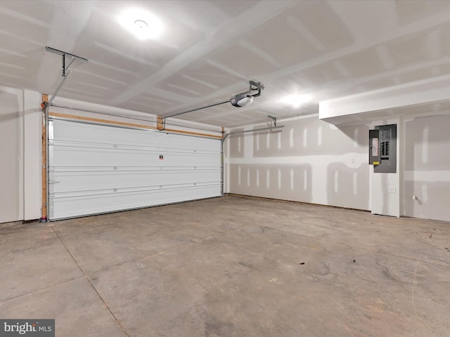 garage featuring electric panel and a garage door opener