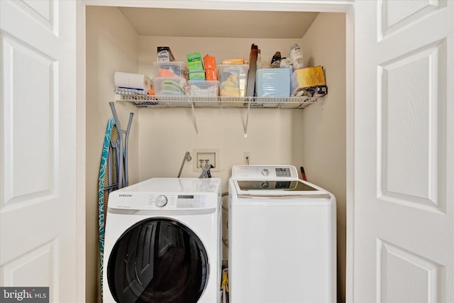 washroom with laundry area and washer and dryer