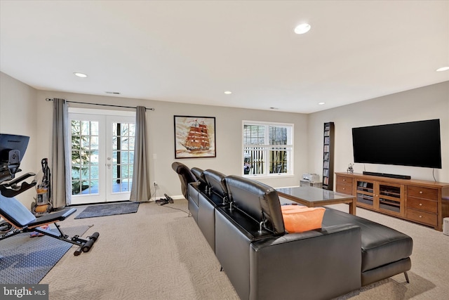 living room with light carpet, recessed lighting, and french doors