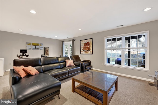 living room with recessed lighting, carpet flooring, visible vents, and baseboards