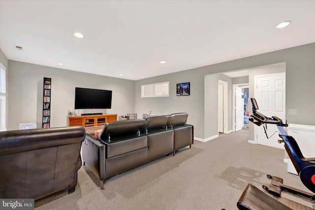 carpeted living room with baseboards, visible vents, a wealth of natural light, and recessed lighting