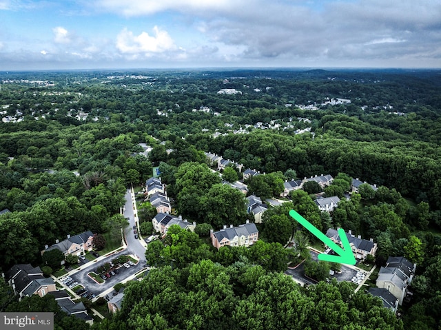 aerial view featuring a wooded view