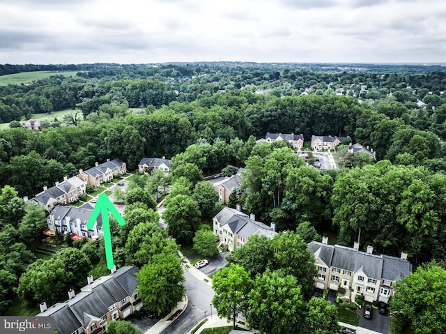 birds eye view of property with a residential view