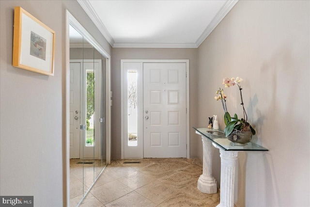 entrance foyer featuring ornamental molding