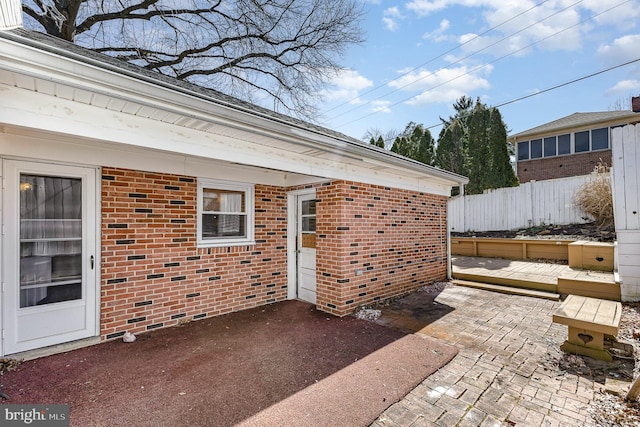 view of patio featuring fence