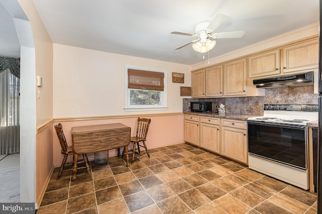 kitchen featuring under cabinet range hood, black microwave, white electric range, and light brown cabinetry