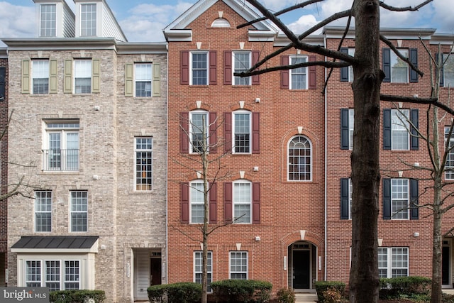 view of front of home featuring brick siding