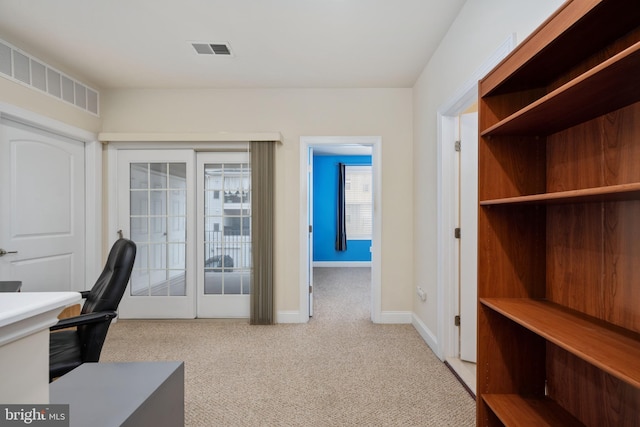 home office featuring carpet, visible vents, and baseboards