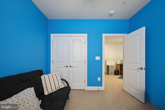 sitting room with carpet flooring and baseboards