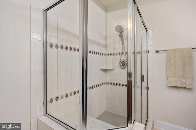 bathroom with a shower stall