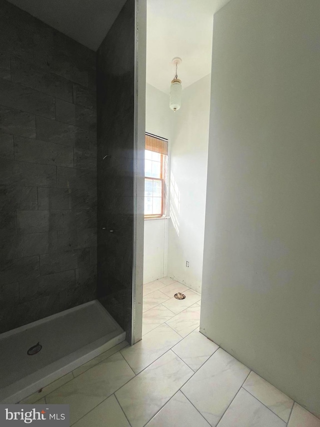 bathroom with tiled shower