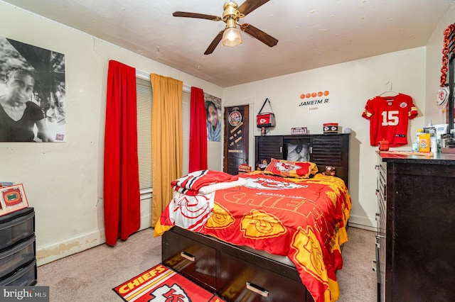 bedroom featuring carpet flooring, baseboards, and ceiling fan