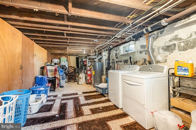 below grade area with gas water heater and washer and clothes dryer