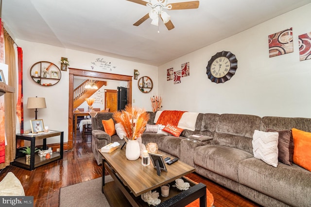 living area featuring hardwood / wood-style floors and ceiling fan