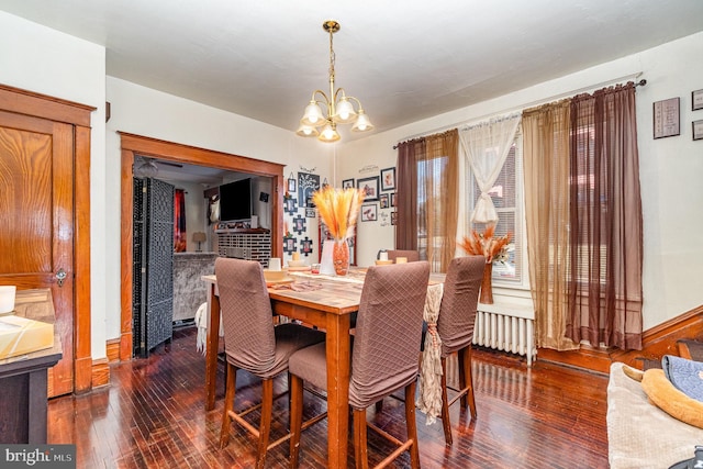 dining area featuring a chandelier and hardwood / wood-style floors