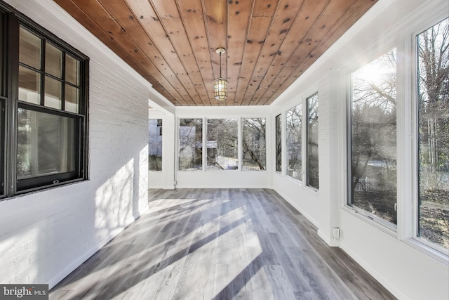 unfurnished sunroom featuring wooden ceiling