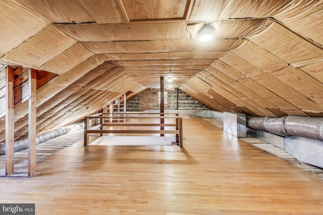 unfinished attic featuring an upstairs landing