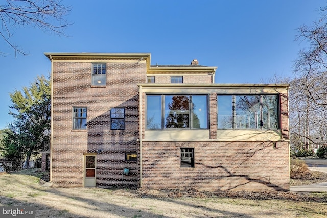 view of home's exterior with brick siding