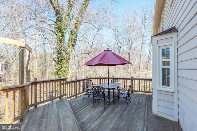 wooden deck with outdoor dining area