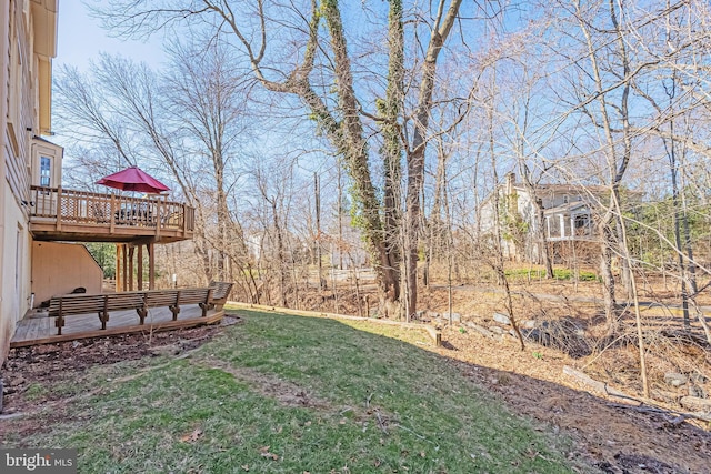 view of yard with a wooden deck