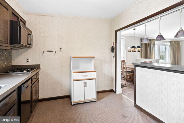 kitchen with a notable chandelier, ornamental molding, black microwave, dishwashing machine, and stainless steel gas cooktop