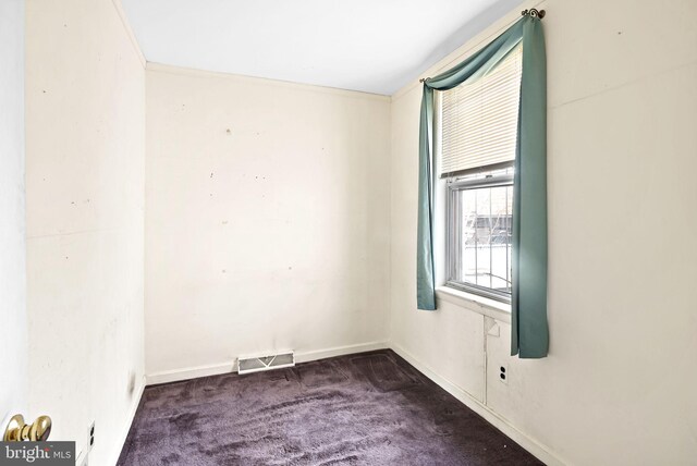 spare room featuring visible vents, baseboards, and carpet floors