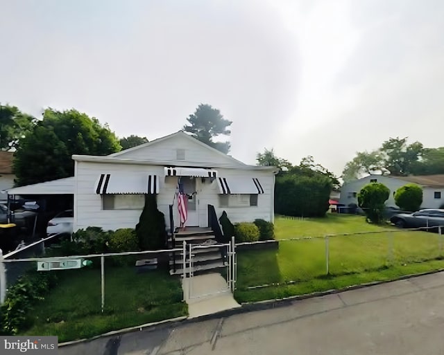 bungalow-style home with a front lawn