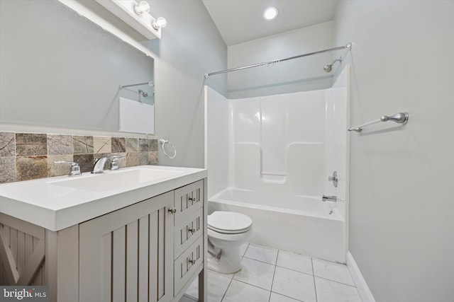 bathroom with toilet, vanity, decorative backsplash, tile patterned floors, and washtub / shower combination