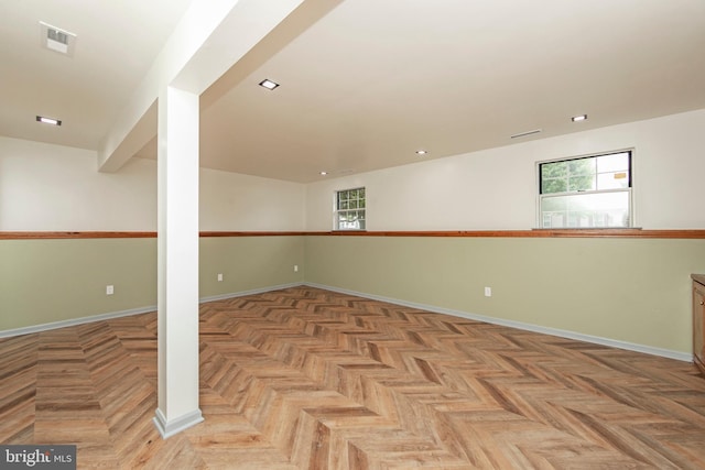 below grade area featuring recessed lighting, visible vents, and baseboards