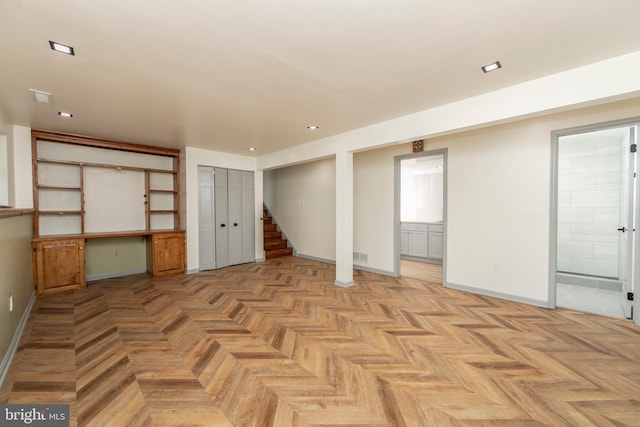 basement featuring stairway, recessed lighting, visible vents, and baseboards