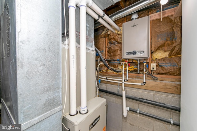 utility room featuring water heater