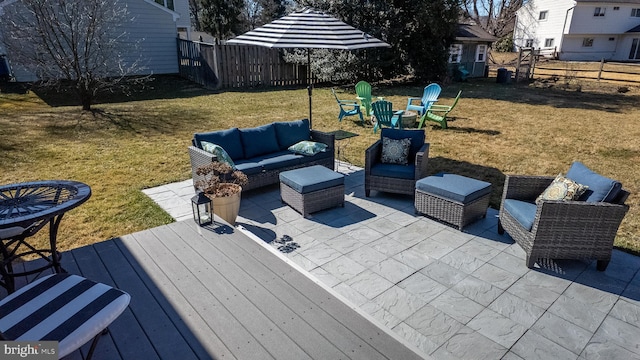 view of patio / terrace with an outdoor living space, a deck, and fence