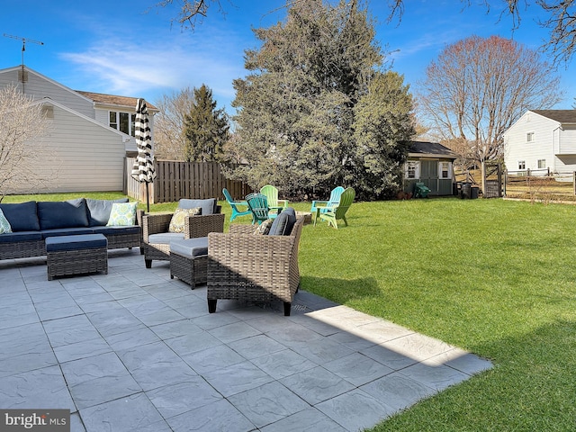 view of patio featuring an outdoor living space and a fenced backyard