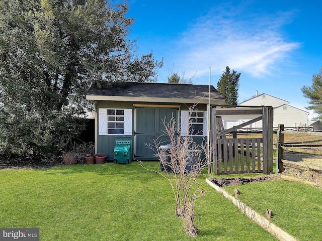 view of outdoor structure with an outdoor structure and fence