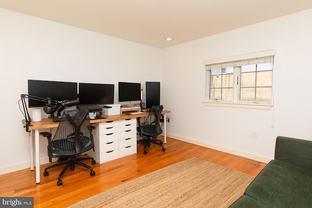 office area featuring light wood finished floors, recessed lighting, and baseboards