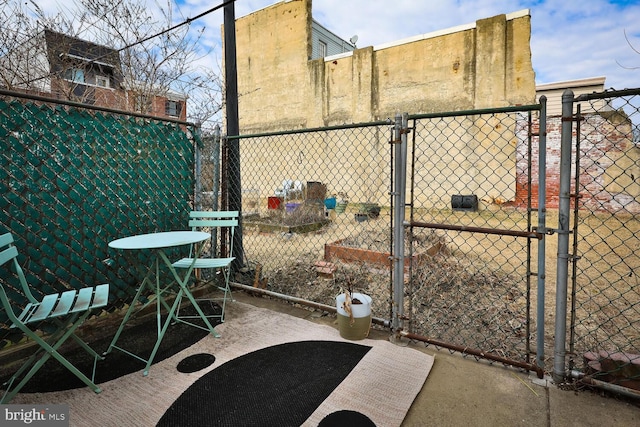 exterior space featuring a gate and fence