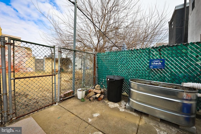 view of patio / terrace featuring a gate and fence