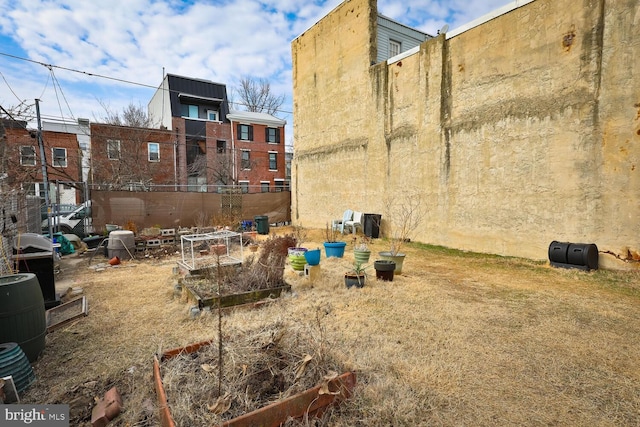 view of yard featuring a garden and fence