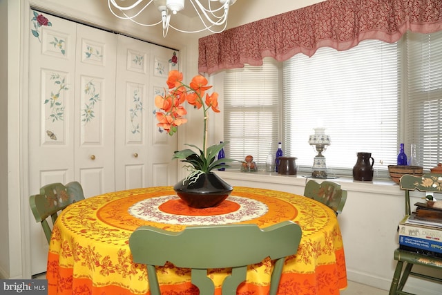 dining area featuring a notable chandelier and plenty of natural light